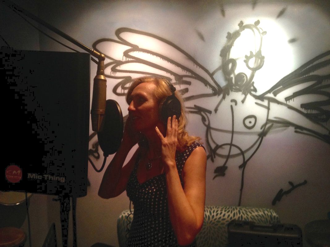Tracey-Ann Palmer singing in a music studio